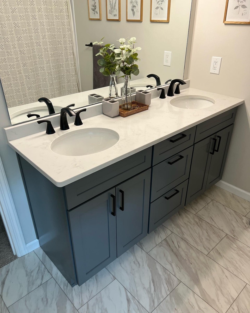 Bathroom renovation with gray double vanity, quartz top, and LVP flooring